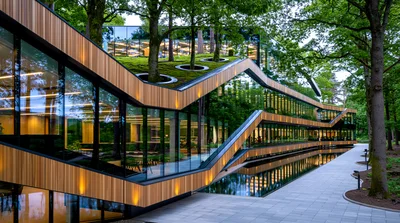 Modern Architectural Building With Green Roof And Forest Surroundings