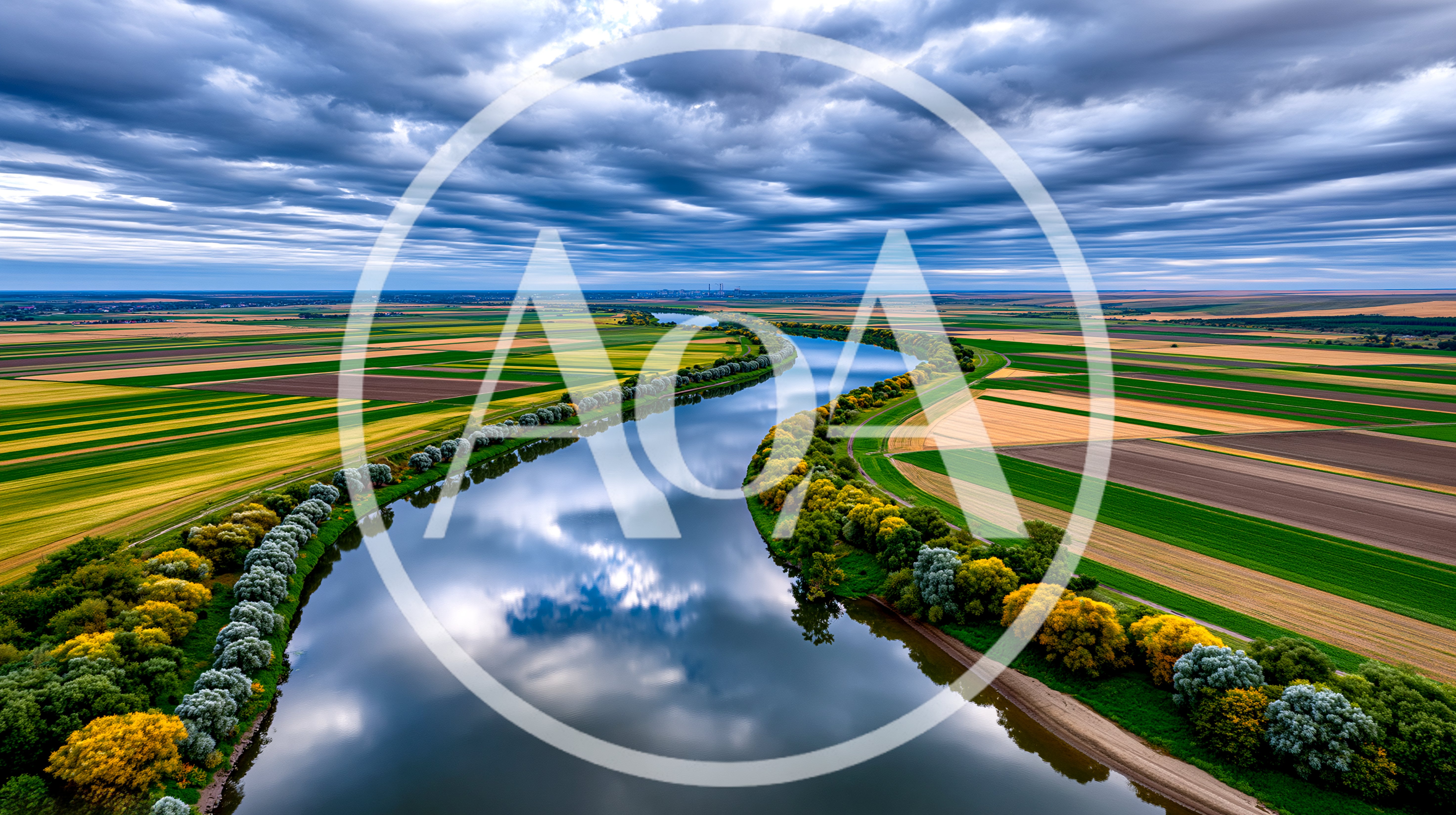 Aerial View Of A Winding River Through Agricultural Fields