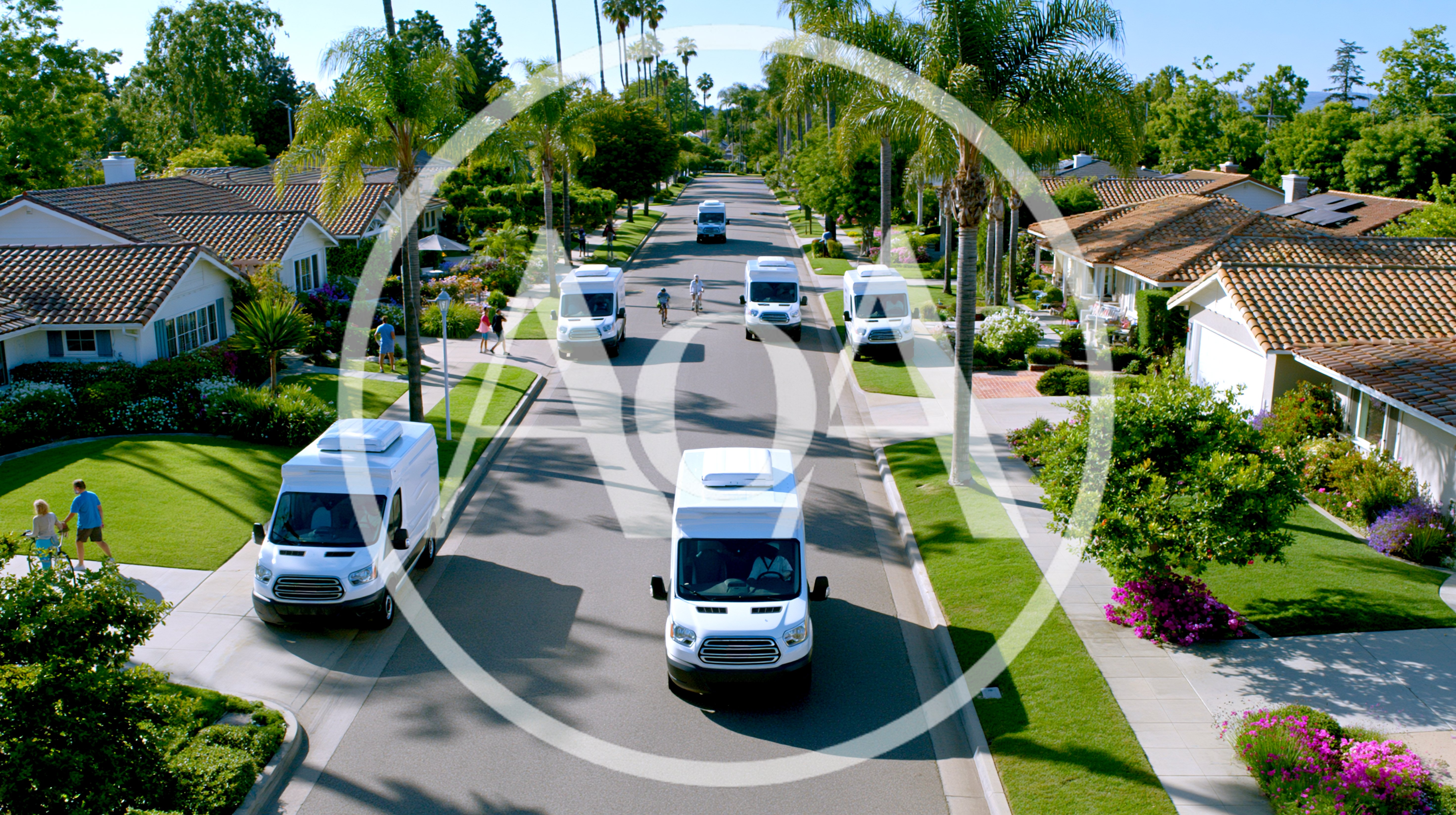 Multiple Delivery Vans Driving Through A Suburban Neighborhood