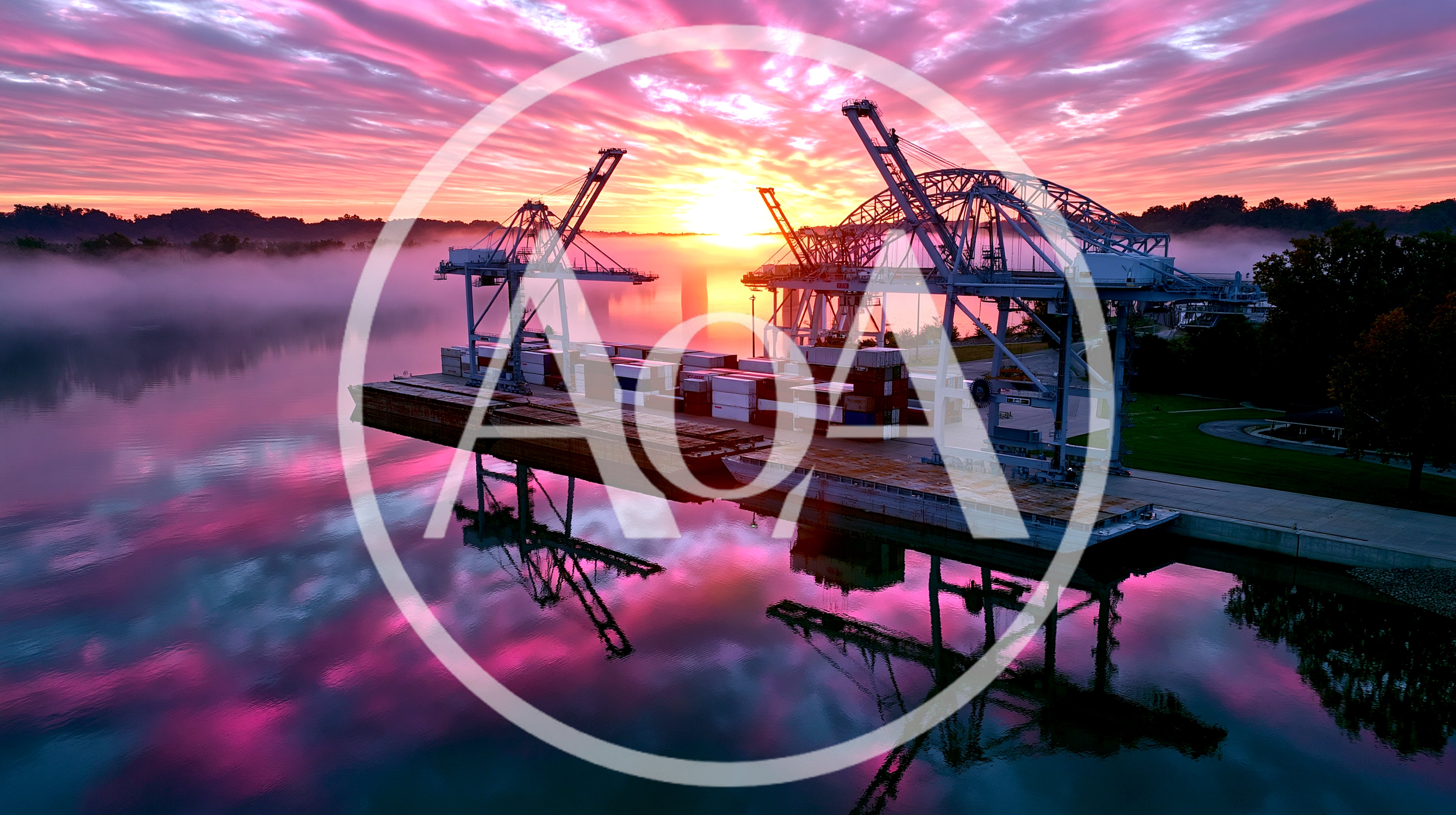 Industrial Port Cranes At Sunrise Over Foggy River