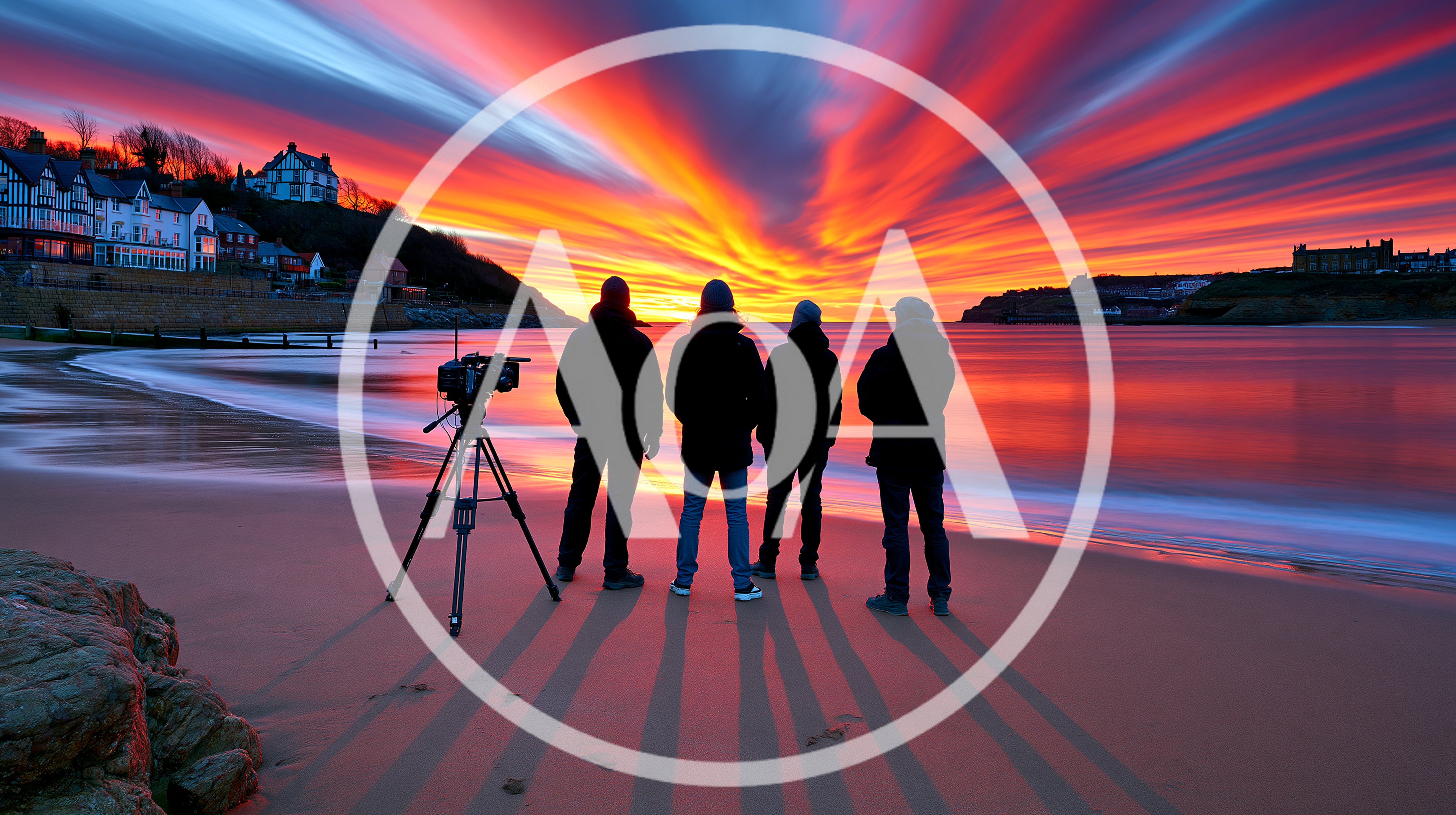 Four Photographers Standing On Beach At Sunset