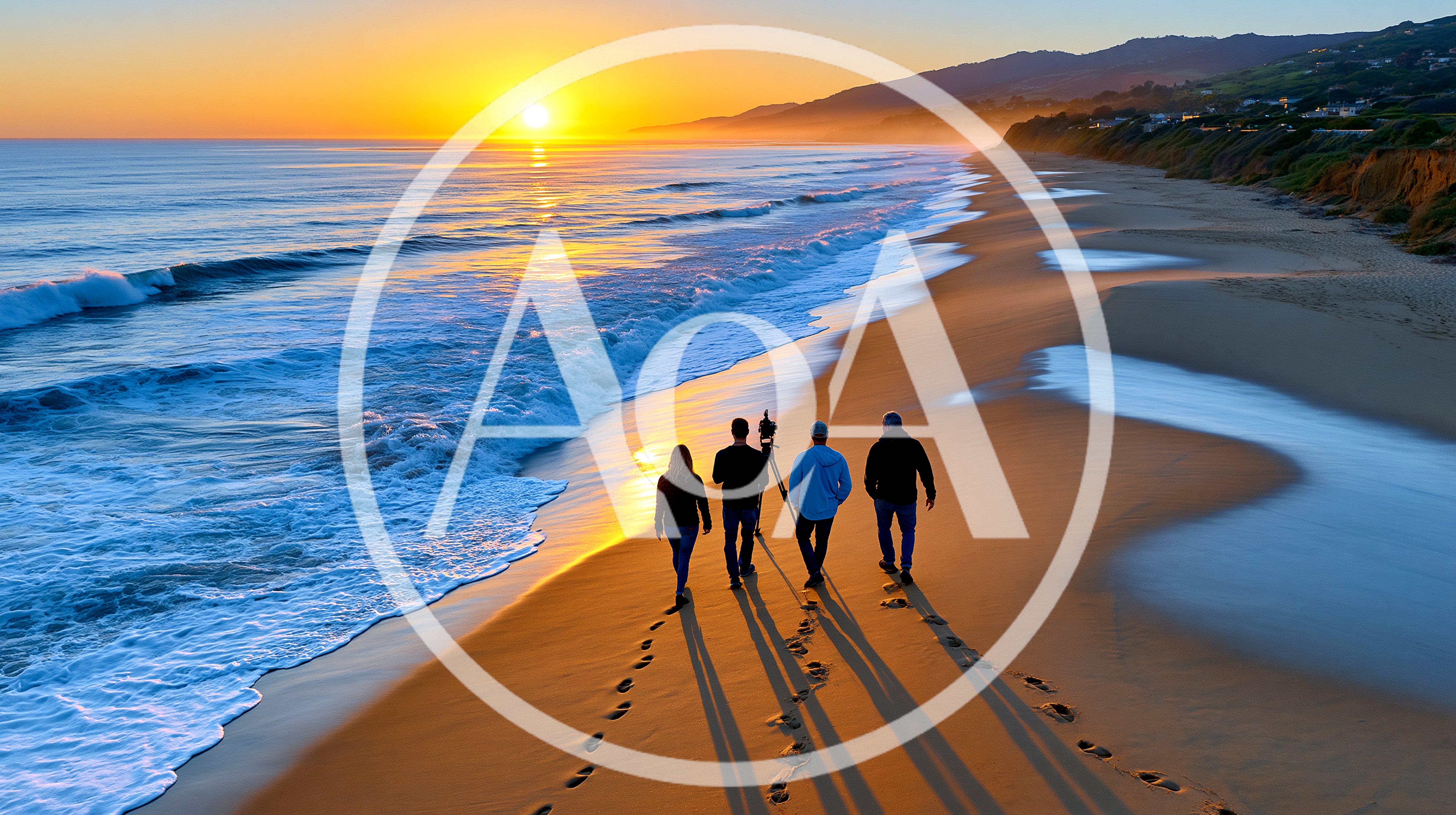 Four People Walking Along Beach At Sunset