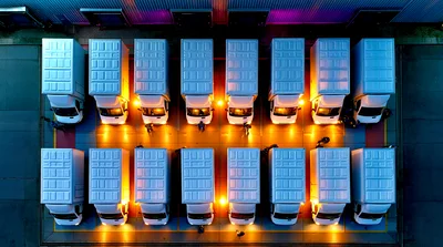 Aerial View Of Delivery Vans Parked At Warehouse
