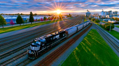 Norfolk Southern Freight Train Moving Through Industrial Rail Yard