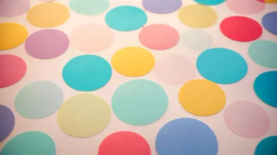 Colorful Paper Circles Arranged On A Light Background