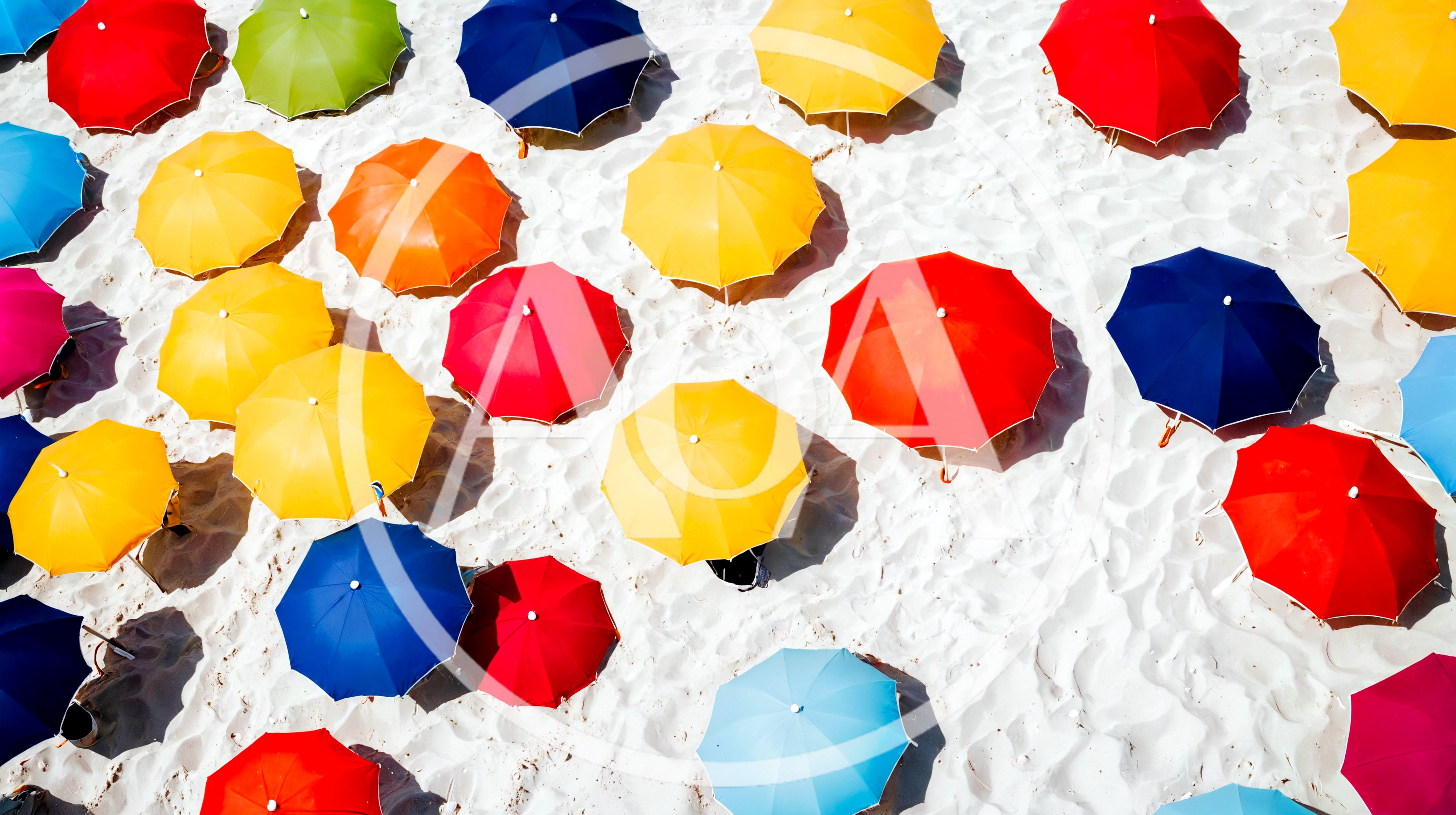Aerial View Of Colorful Beach Umbrellas On White Sand