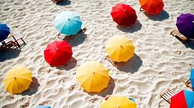 Aerial View Of Colorful Beach Umbrellas On White Sand