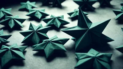 Dark Green Origami Stars Arranged On A Textured Surface