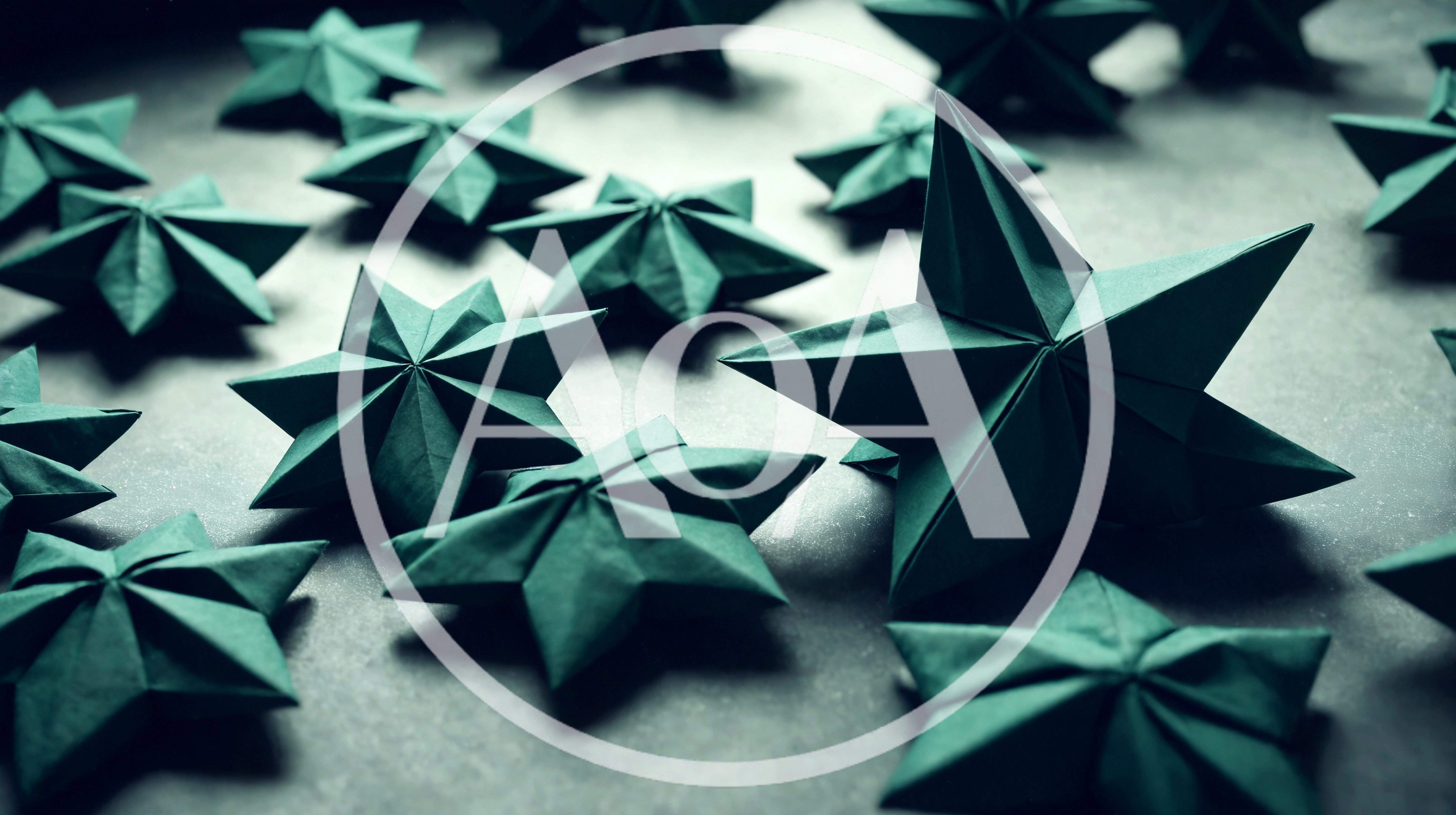 Dark Green Origami Stars Arranged On A Textured Surface