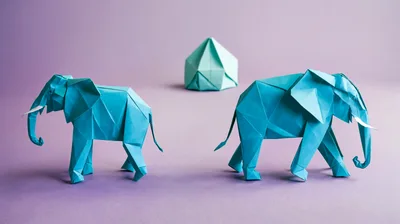 Two Blue Origami Elephants With Geometric Paper Structure