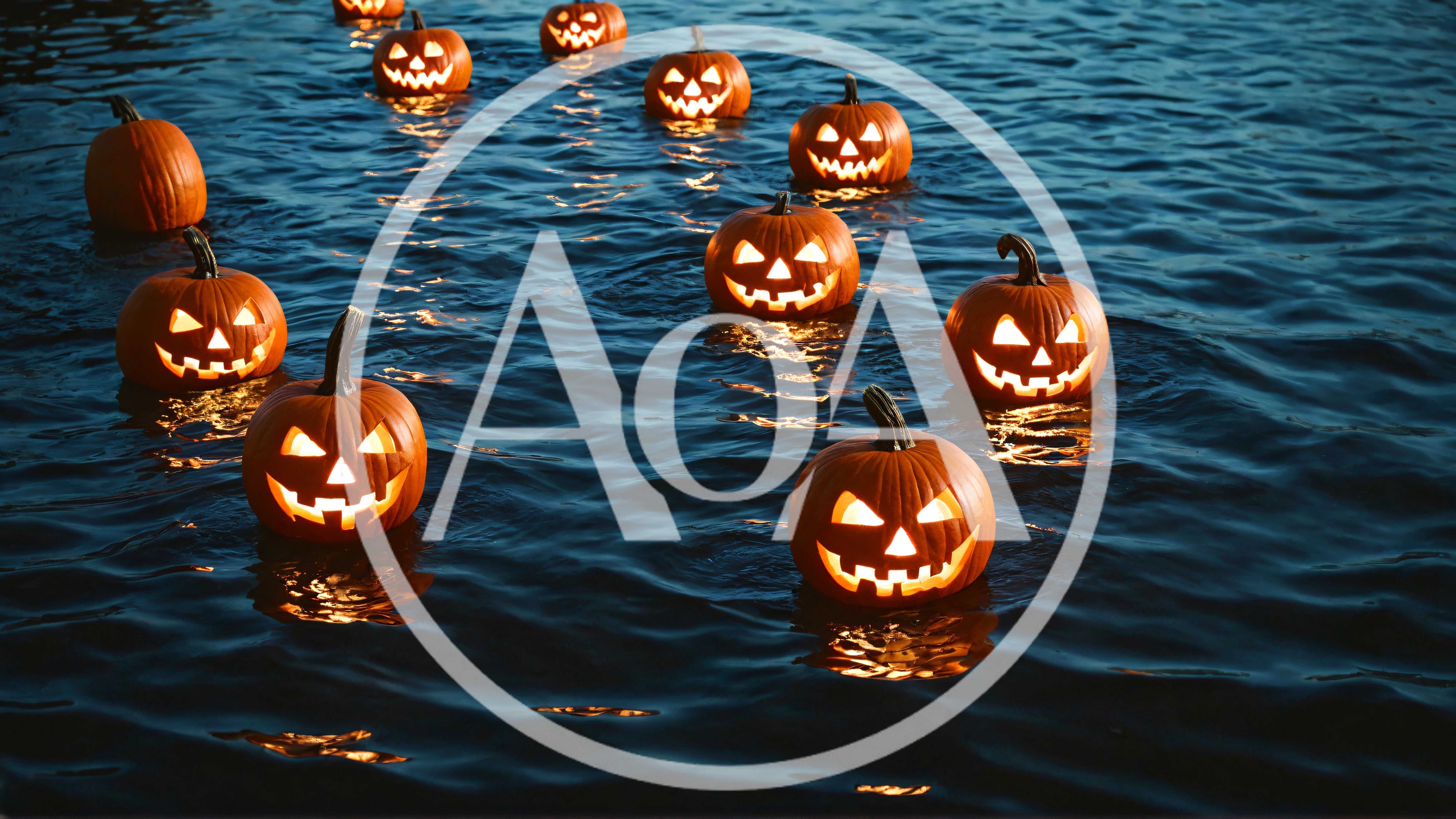 Jack O Lantern Pumpkins Floating On Dark Water