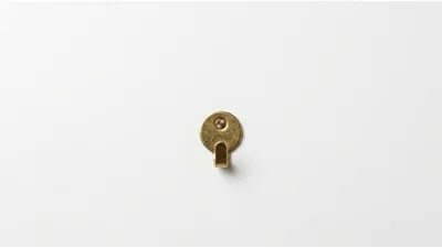 Brass Wall Hook Mounted On White Background