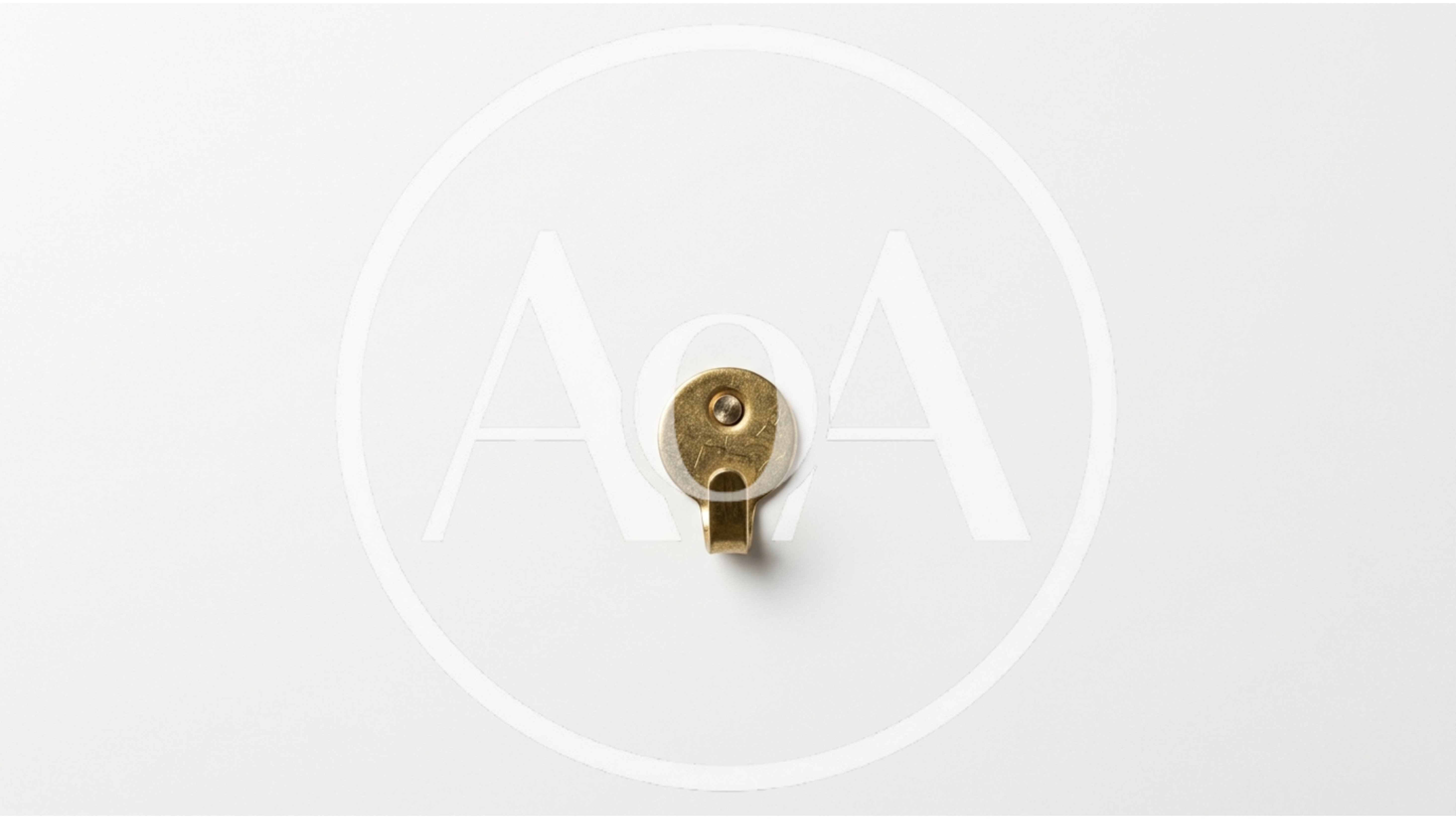 Brass Wall Hook Mounted On White Background