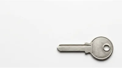 Single Silver Metal Key Isolated On White Background