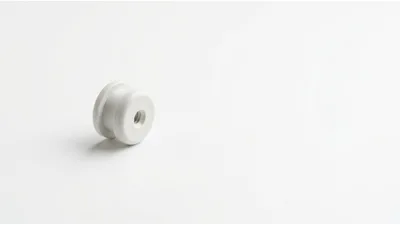 White Plastic Spool Component On White Background
