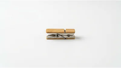 Wooden Clothespin With Metal Spring On White Background