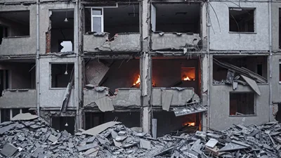 Damaged Apartment Building Burning After Artillery Strike