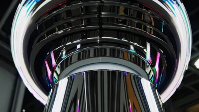Futuristic Chrome Pillar With Rotating Colorful LED Lights