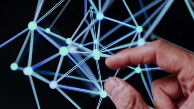 Hand Interacting With Digital Network Node Visualization