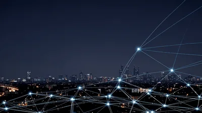 Digital Network Connections Over A Night City Skyline