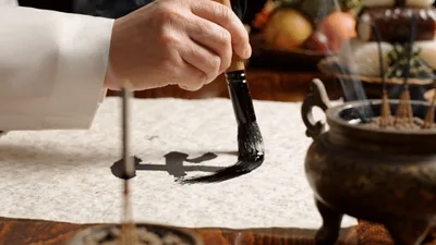 Calligrapher Painting Traditional Chinese Character With Ink Brush
