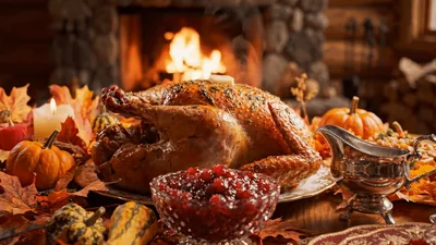 Roasted Thanksgiving Turkey Dinner Table Setting With Fireplace