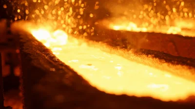 Molten Metal Flowing Through Industrial Casting Channel