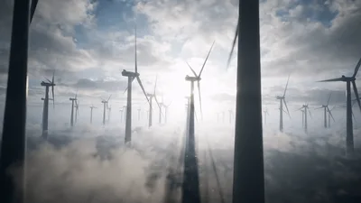 Aerial View Of Wind Turbines Above The Clouds