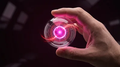 Hand Holding A Glowing Futuristic Energy Sphere