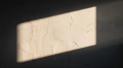 Sunlight Beam Casting Rectangular Shape On Cracked Wall