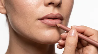Professional Makeup Artist Applying Lip Liner