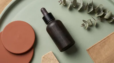 Wooden Dropper Bottle on Green Tray with Eucalyptus