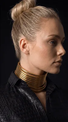 Woman Wearing Gold Choker Necklace Posing For Camera