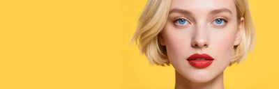 Portrait Of A Blonde Woman With Red Lips and Blue Eyes