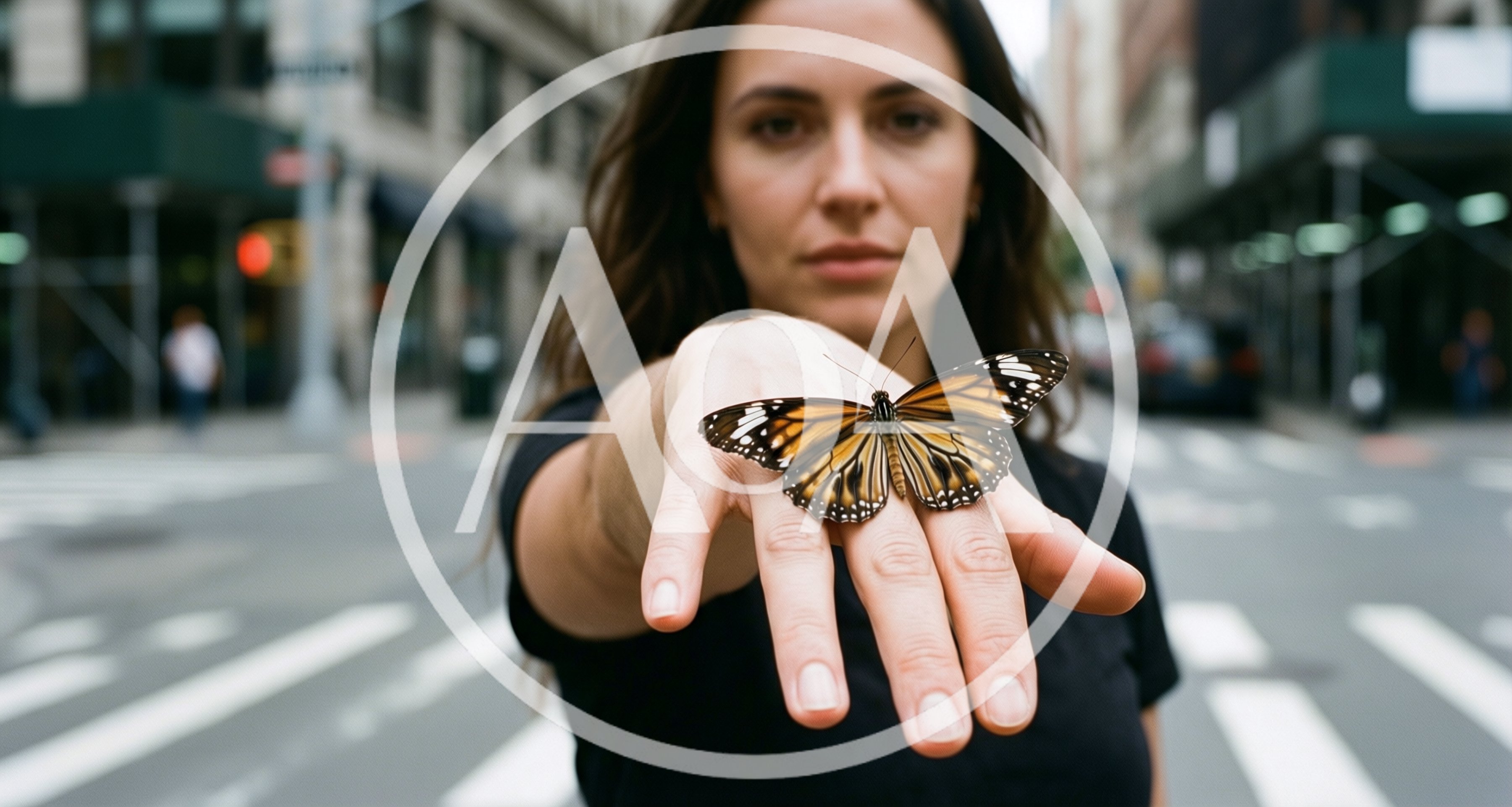 Woman Holding A Monarch Butterfly On Her Hand