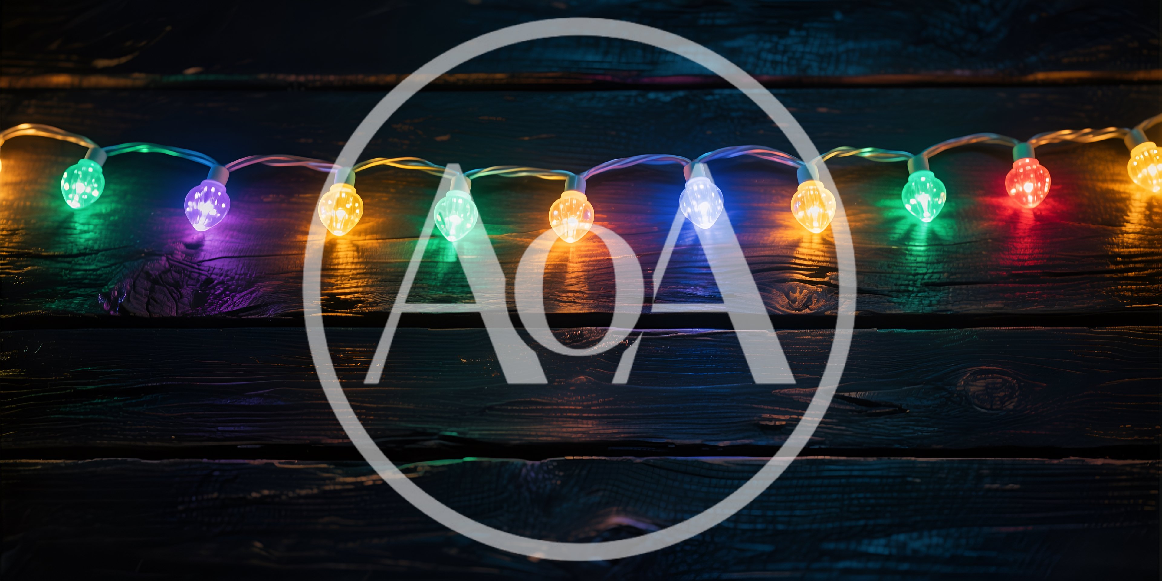 Colorful Christmas String Lights On Dark Wooden Background