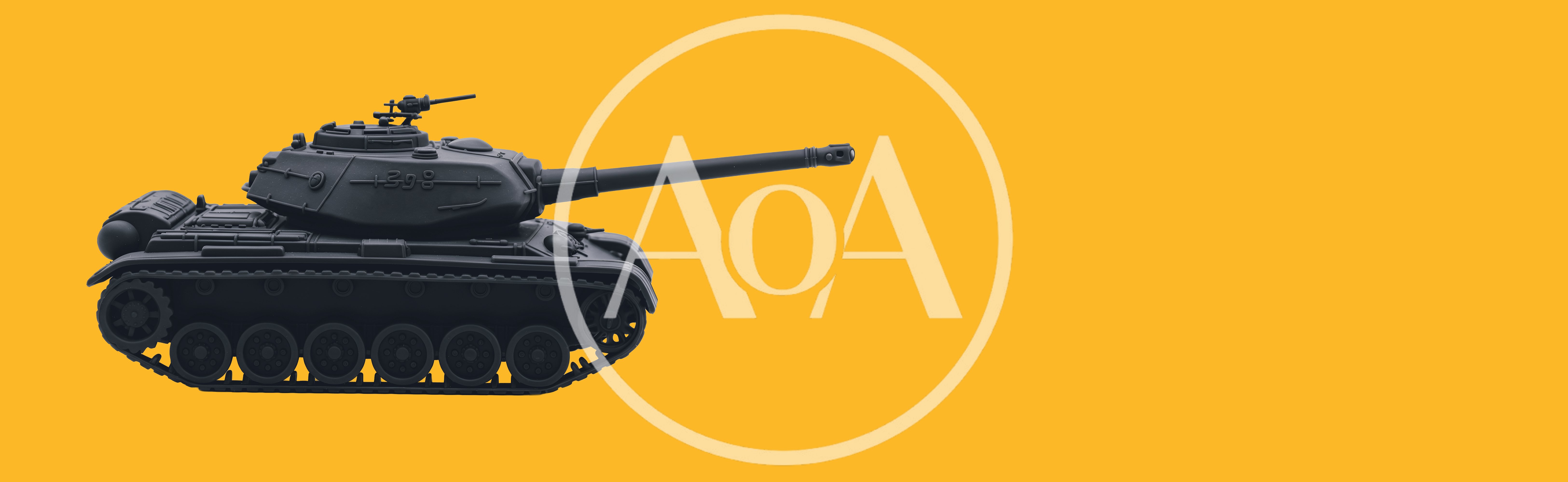 Black Toy Tank Isolated On Yellow Background