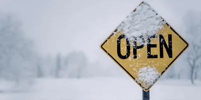 Yellow Open Sign Covered In Winter Snow