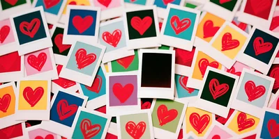 Collection of Colorful Polaroid Photos with Hand-Drawn Hearts