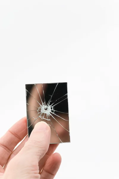 Hand Holding A Small Broken Rectangular Mirror