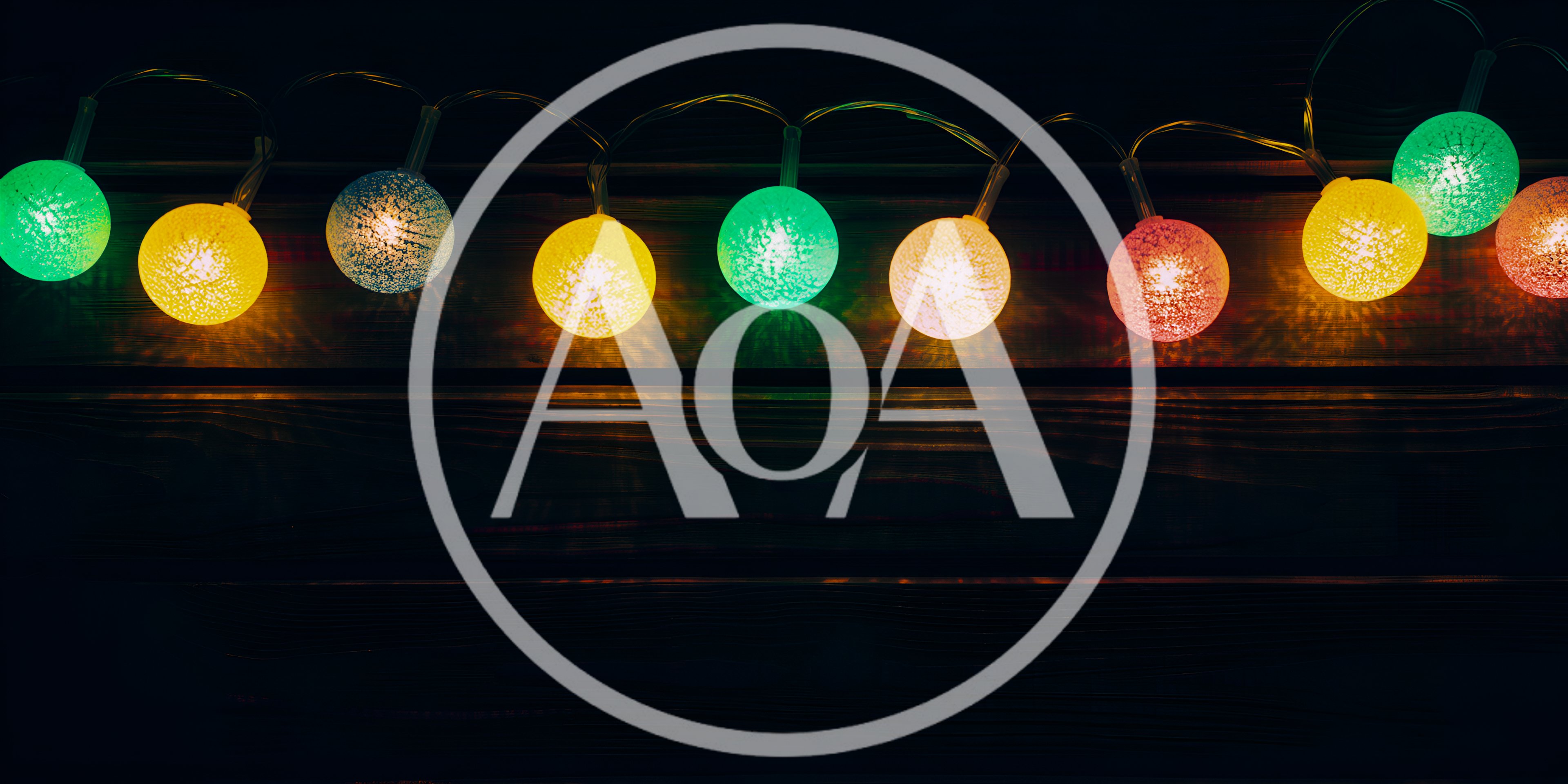 Colorful Decorative String Lights Against Dark Wooden Background