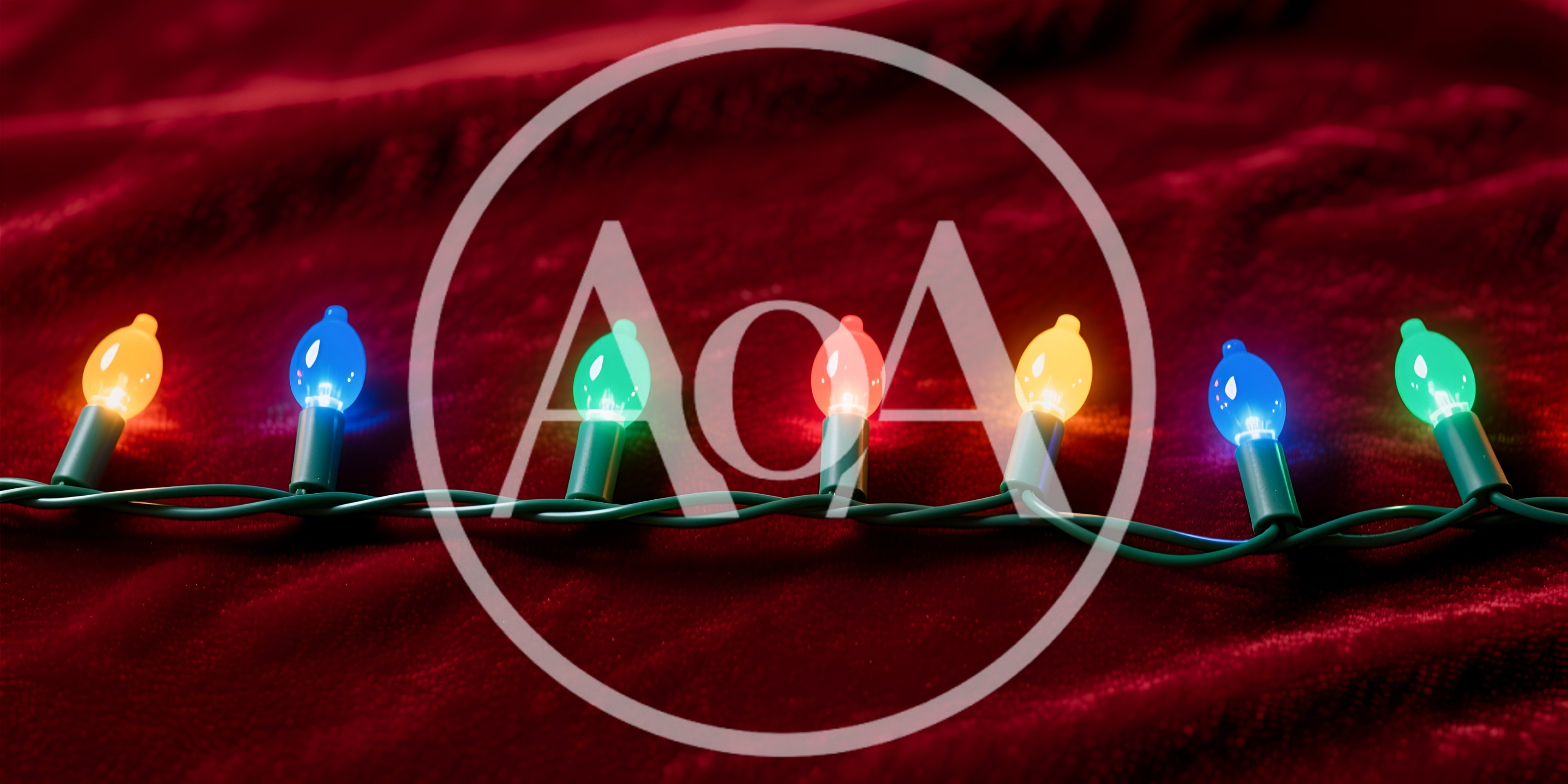Colorful Christmas String Lights On Red Velvet Fabric