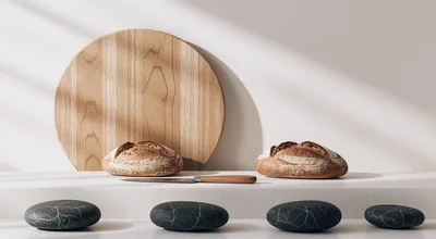Two Loaves Of Sourdough Bread On A Kitchen Counter