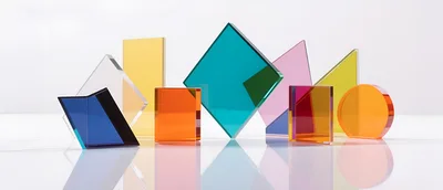 Colorful Translucent Geometric Acrylic Shapes on White Surface
