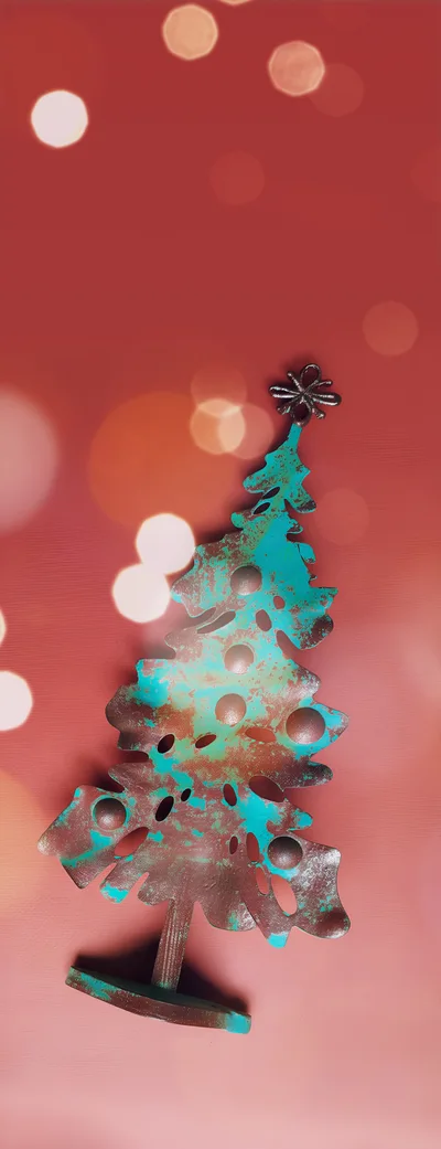 Rustic Metal Christmas Tree Ornament on Red Background