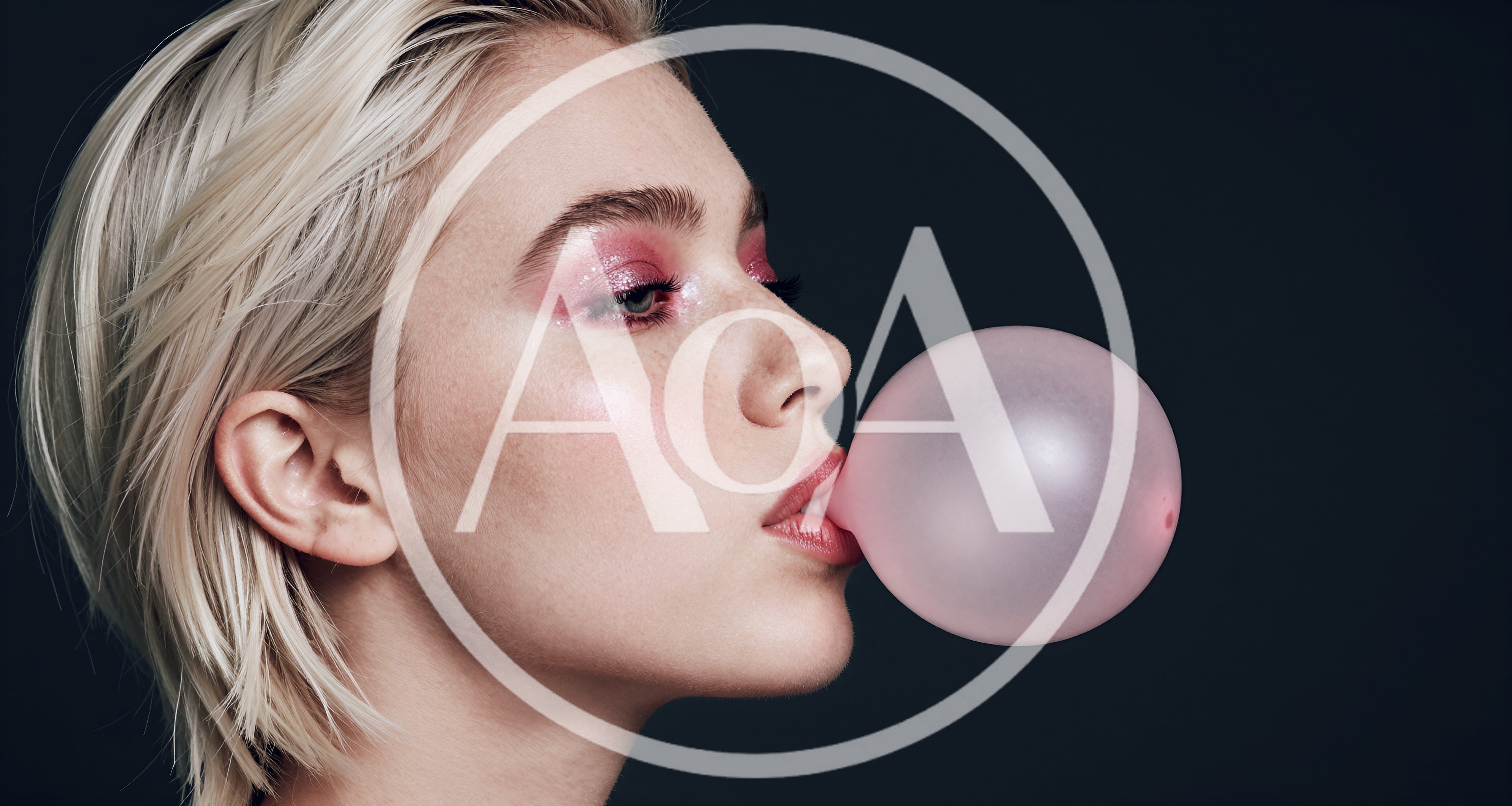 Young Woman Blowing A Pink Bubblegum Bubble