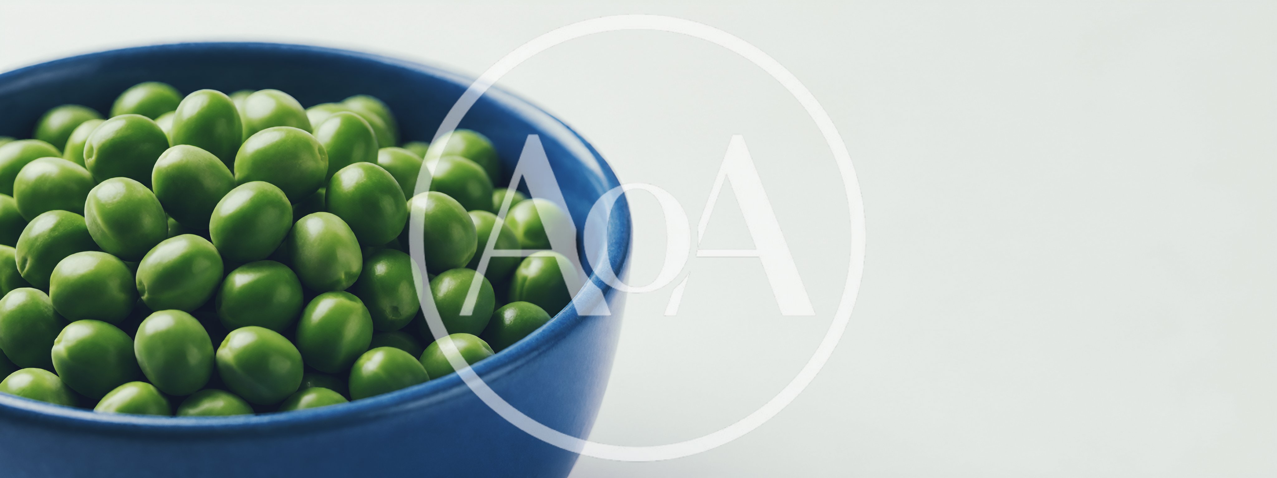 Fresh Green Peas In A Blue Bowl