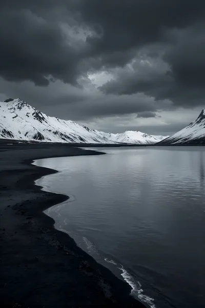 Dramatic Icelandic Landscape With Black Sand Beach And Mountains