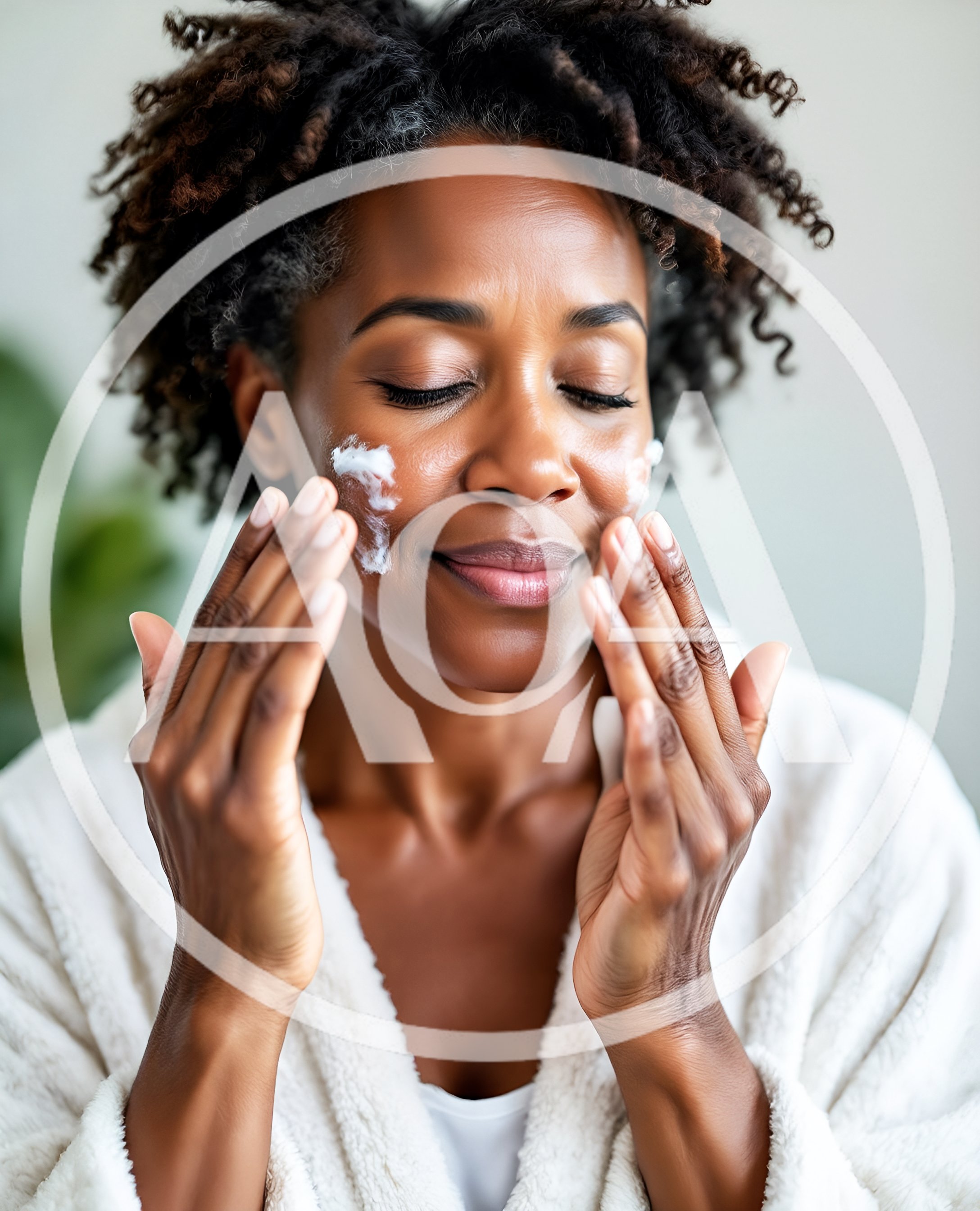 African American Woman Applying Facial Cream