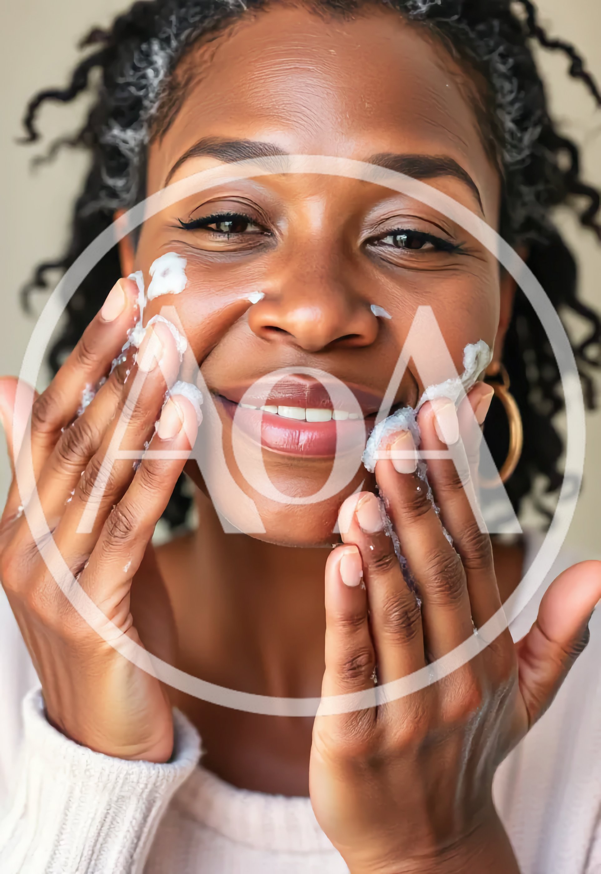 Middle Aged Black Woman Applying Facial Cleanser